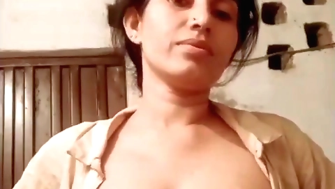 Solo video of a big tits brunette showing off her natural breasts