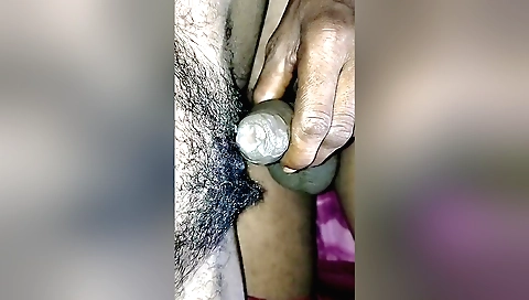 Indian chick gets hairy on the bed and spreads her legs