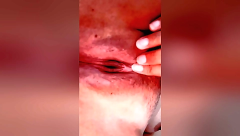 Amateur solo female video showing fingering her pink pussy