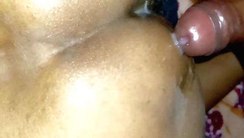 Indian girl in a red veil and a dress plays with her lover