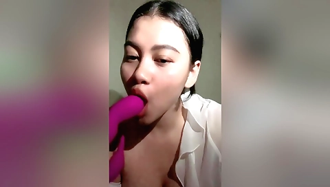 Hot brunette solo girl in a red lingerie with vibrator