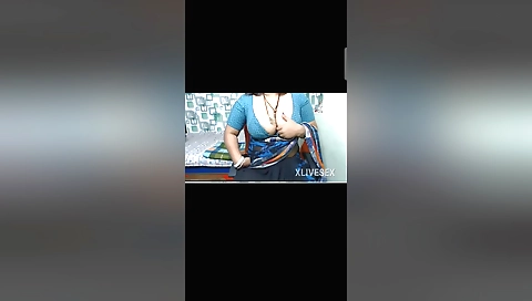 Indian beauty in leather pants showing off her boobs