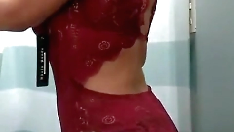 Brunette with a sexy white dress in the trial room