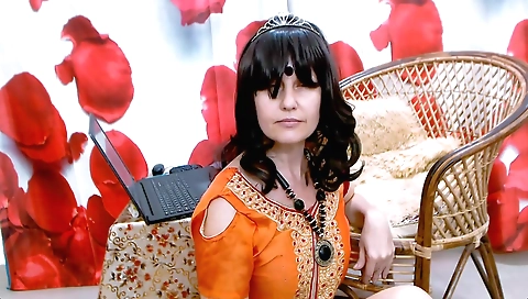 Solo female amateur video with a brunette in a black dress