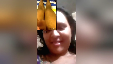 Brunette with big boobs is filming in a webcam video